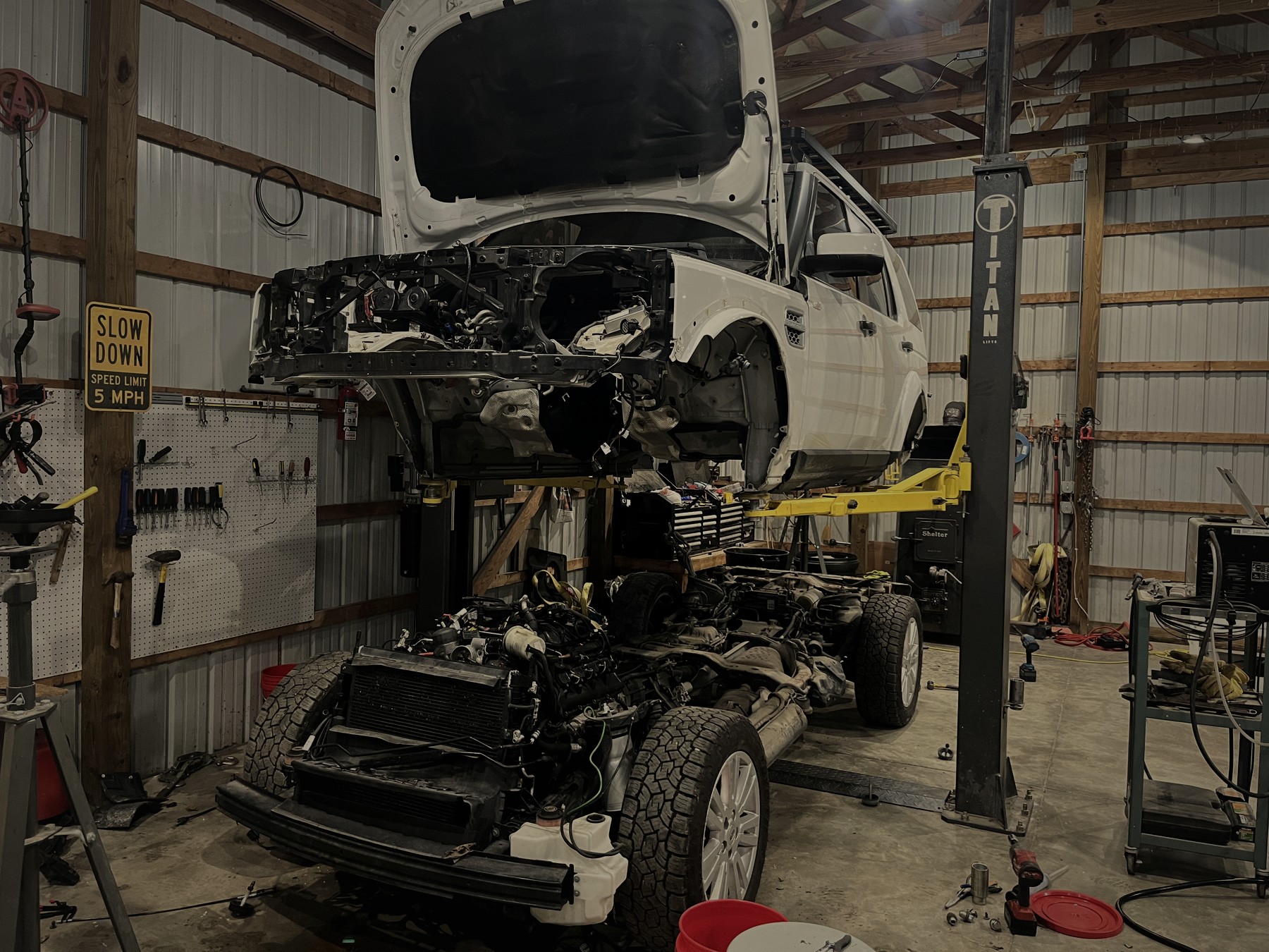 LR4 body-off on the lift in the Hoosier British 4x4 bay